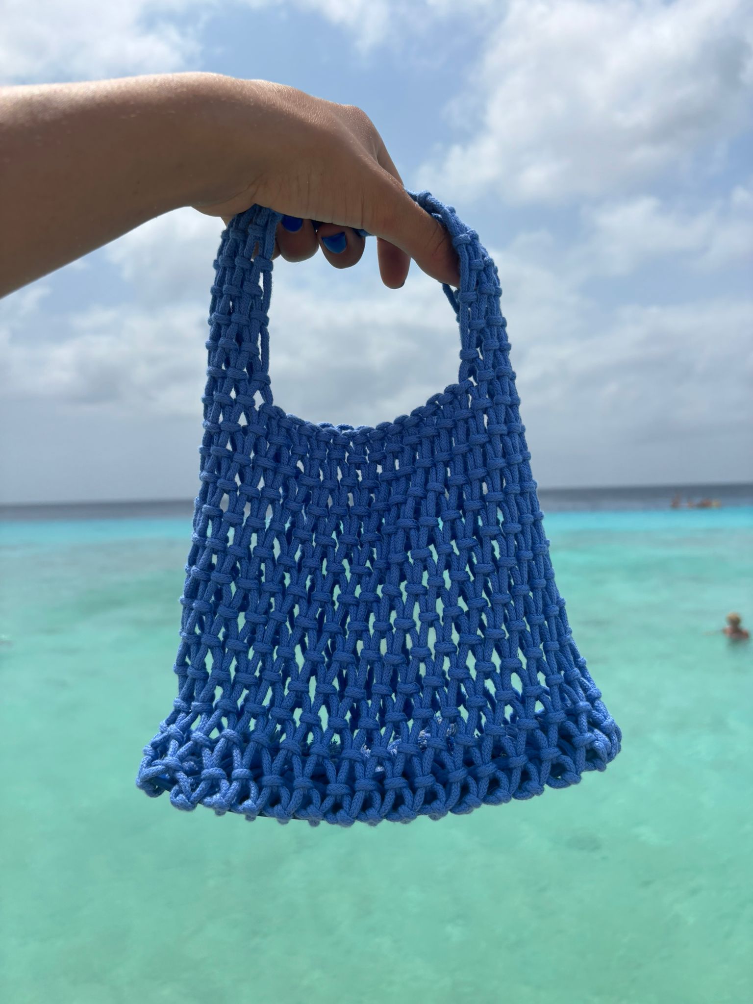 Small Blue Crocheted bag of the Loa brand.