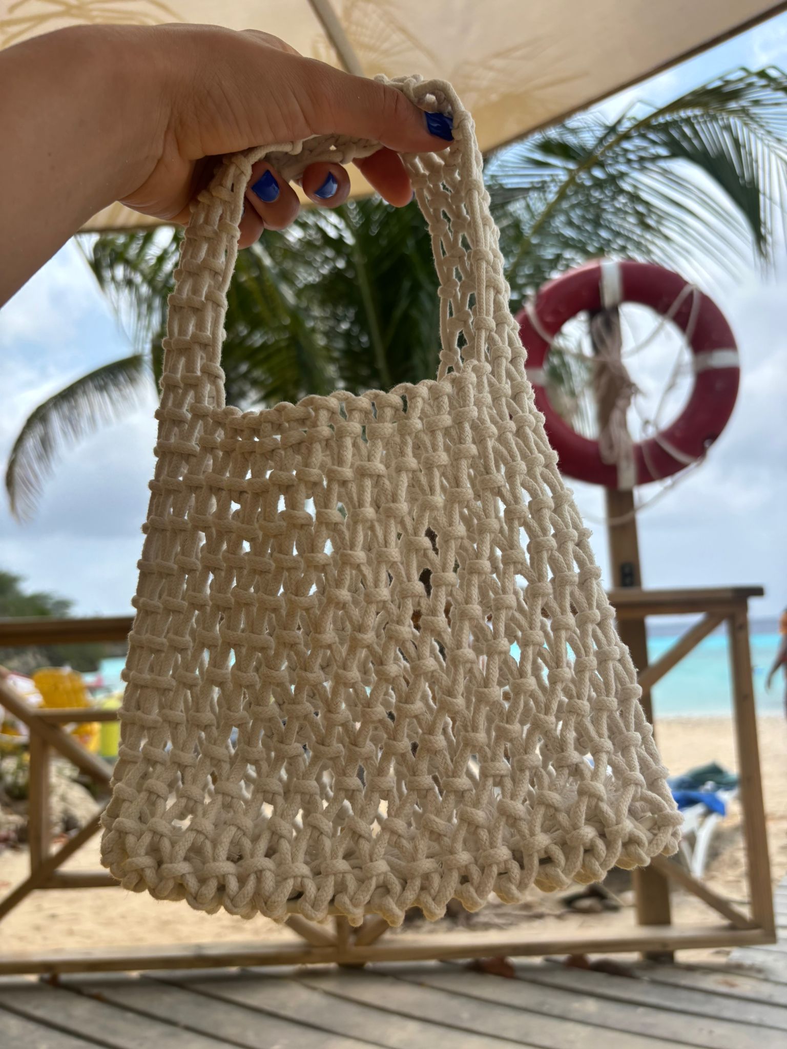 Small white Crocheted bag of the Loa brand
