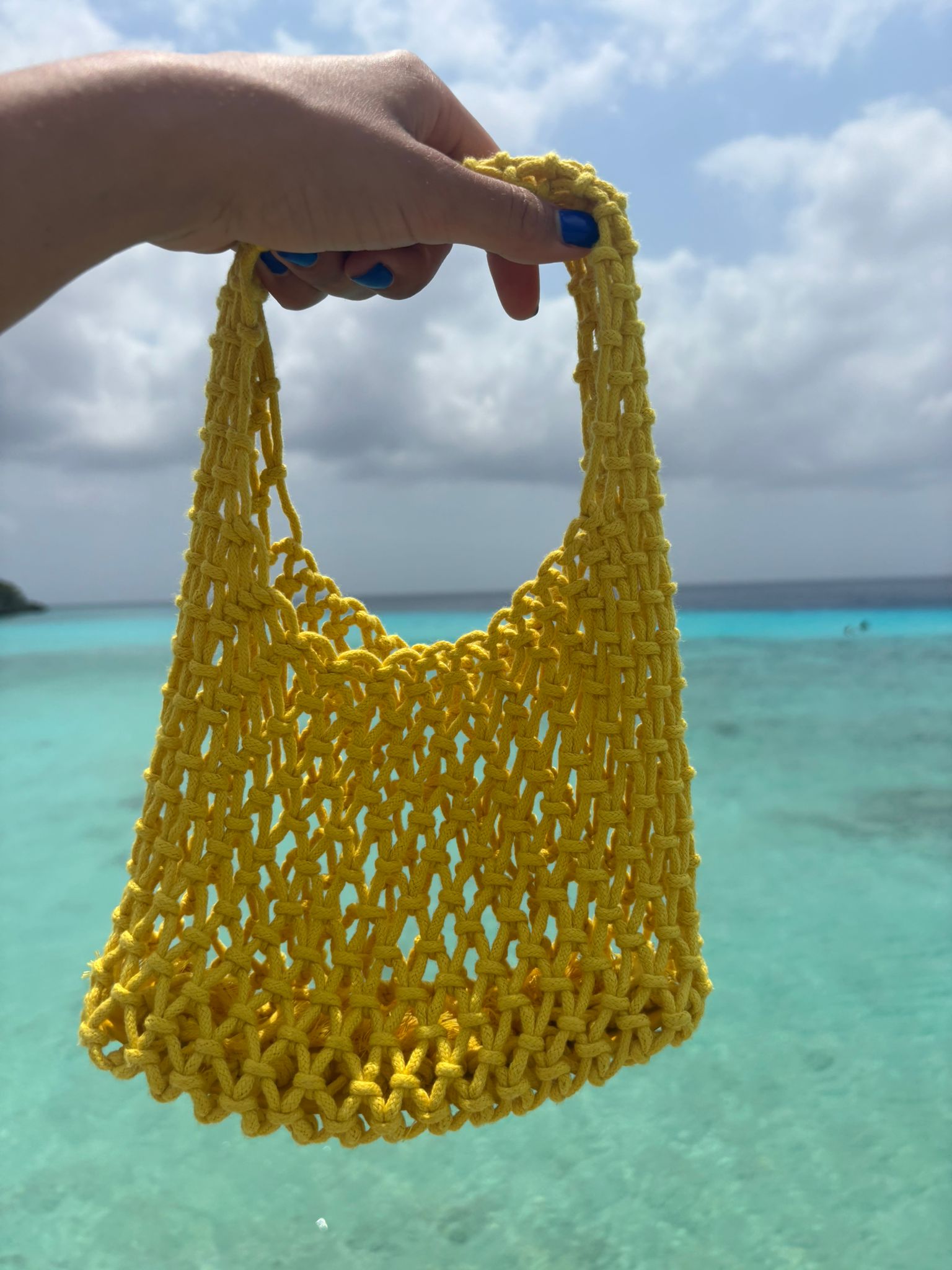 Small yellow Crocheted bag of the Loa brand. 
